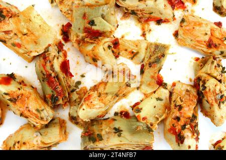 artichokes salad with vegetable mix sauce dressing isolated on white background. Stock Photo