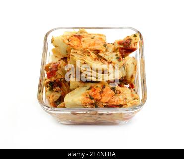 artichokes salad with vegetable mix sauce dressing in a bowl isolated on white background. Stock Photo