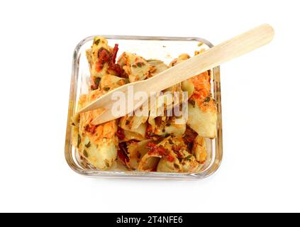 artichokes salad with vegetable mix sauce dressing in a bowl isolated on white background. Stock Photo