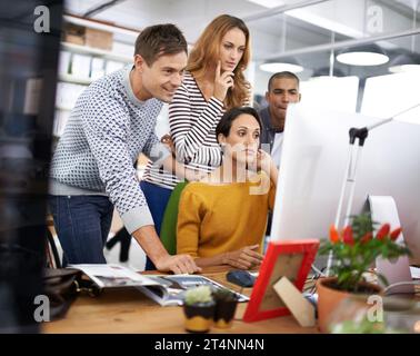 Theyre a focused and professional team. A young team of design professionals having a meeting. Stock Photo