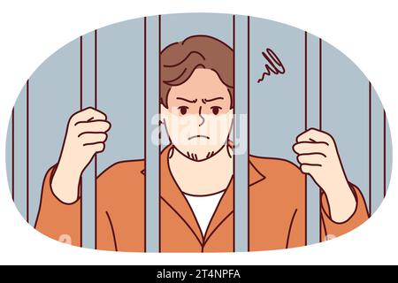 Unhappy man in robe behind bars in jail. Angry male criminal imprisoned