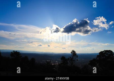Heavenly sky, sun breaking through clouds from Mount Ainslie, Canberra Stock Photo