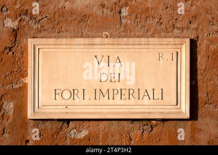 'Via dei Fori Imperiali' marble plaque on a wall, Rome, Italy Stock Photo