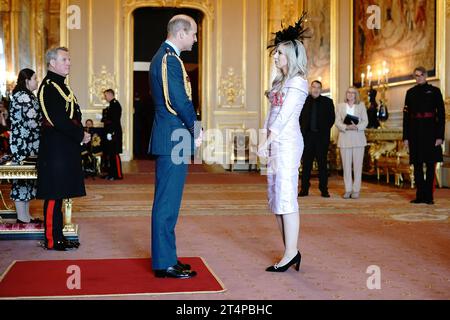 Miss Fallon Sherrock, from Milton Keynes, is made a Member of the Order of the British Empire by the Prince of Wales at Windsor Castle, Berkshire. The honour recognises services to darts. Picture date: Wednesday November 1, 2023. Stock Photo