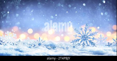 Snowflakes On Snow With Bokeh Of Christmas Lights - Real Snowdrift And Acrylic Crystals - This Image Contain 3D Rendering Stock Photo