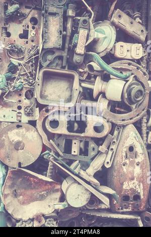 Abstract industrial background made of old machine parts, selective focus, color toning applied. Stock Photo