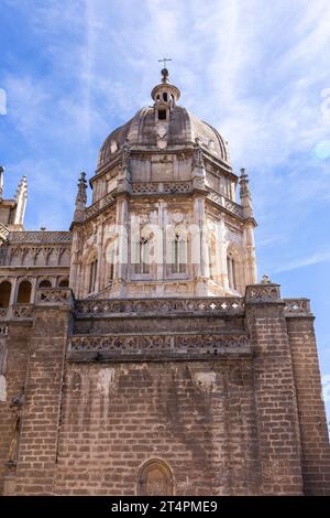 Toledo Cathedral, Gothic church facade of Mozarabic chapel dome seen from Plaza del Ayuntamiento, Toledo, Spain, low angle view, blue sky, Spain. Stock Photo