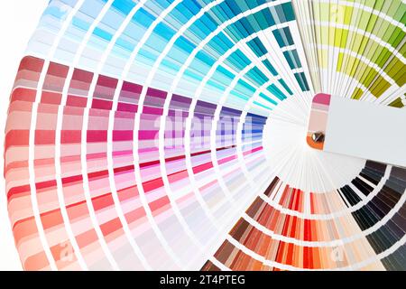 Close-up of color swatches book. Diverse colors paint samples catalog. Stock Photo