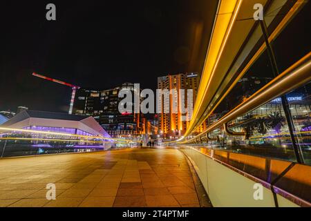 view of the city skyline at night, taken from a footbridge over the River Torrens Stock Photo