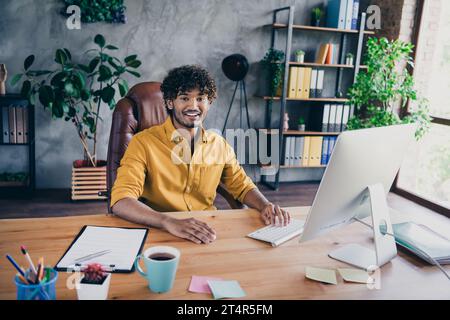 Photo of funny cheerful man server engineer working programming cyber space modern office room Stock Photo