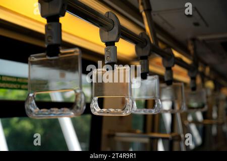 Close-up to Train handle in selected focus by public transportation that isolated from background Stock Photo
