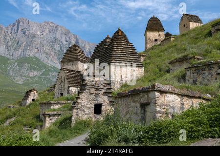 Ancient crypts in the city of the dead Dargavs on a sunny June day. North Ossetia-Alania, Russian Federation Stock Photo