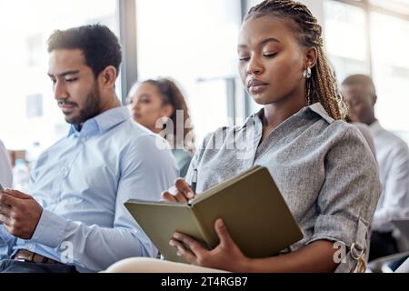 The successful knows theres always room for improvement. a woman making notes during a conference. Stock Photo