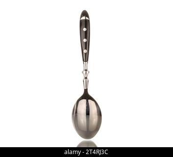 One metal spoon, macro, isolated on white background. Stock Photo