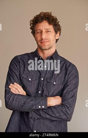 Hes the modern man. a handsome young man in the studio. Stock Photo