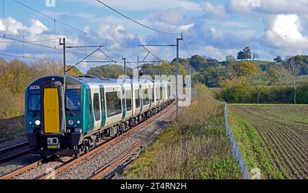 London Northwestern Railway Class 350 electric multiple unit is seen at Bugbrooke Northamptonshire on it's journey from London Euston to Crewe. Stock Photo