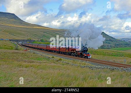 LMS Princess Pacific No. 6201 Princess Elizabeth is seen nearing the summit of the long climb to Ais Gill with the Cumbrian Mountain Express. Stock Photo