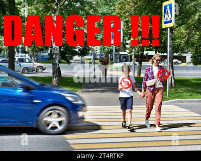 Danger of using smartphone by pedestrians on the road Stock Photo