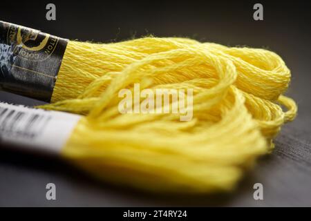 Yellow yarn on a black background seen up  close Stock Photo