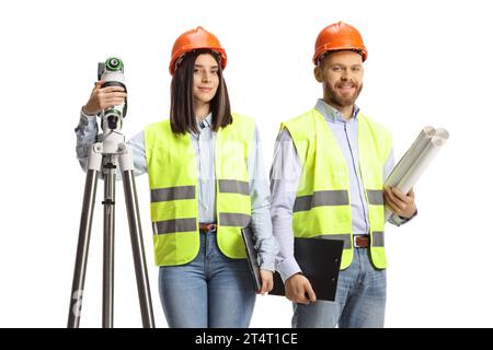 Female geodetic surveyor with a measuring device and a male engineer posing isolated on white background Stock Photo