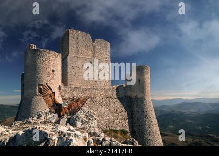 A beautiful mountain landscape with the Castle of Rocca Calasciothe Province of L'Aquila, Abruzzo, Italy. In the foreground there is an eagle. Stock Photo