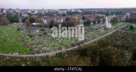 DONCASTER, UK - OCTOBER 17, 2023. Aerial view directly above Hyde Park Cemetery in Doncaster, South Yorkshire with rows of graves and tombstones in a Stock Photo