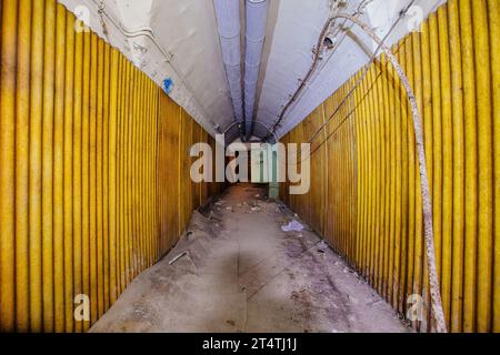 Old vaulted corridor of Soviet bunker, echo of Cold War. Stock Photo