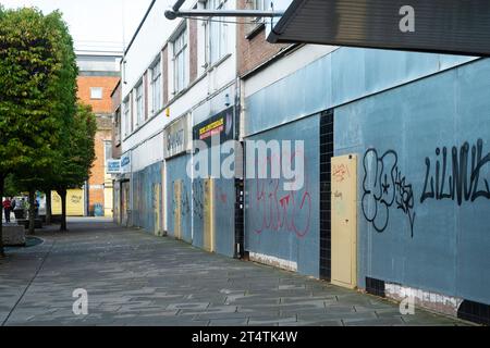 closed down out of business boarded up row of stores portsmouth england uk Stock Photo