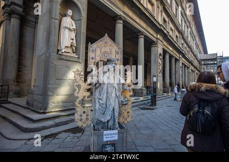 Florence, Italy: A street performer on the premises of Uffizi Gallery in Piazzale degli Uffizi in Florence. Italy Stock Photo