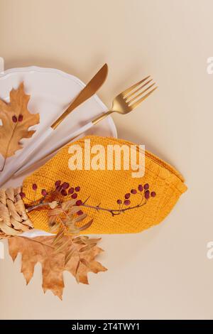 Autumn table setting with dry leaves decorations Stock Photo