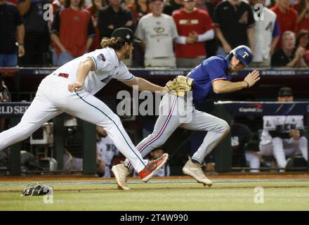 Phoenix, United States. 12th Jan, 2023. Texas Rangers Evan Carter is tagged out by Arizona Diamondbacks pitcher Kevin Ginkel in a rundown between third base and home in the seventh inning in game five of the 2023 World Series at Chase Field, in Phoenix, Arizona on Wednesday, November 1, 2023. Photo by John Angelillo/UPI. Credit: UPI/Alamy Live News Stock Photo