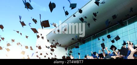 Graduating students hands throwing graduation caps in the air Stock ...