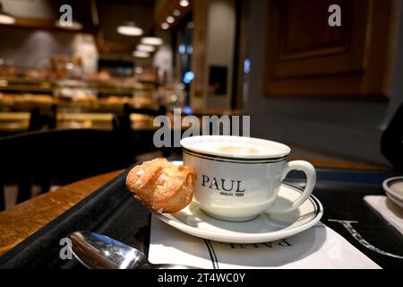 PAUL Bakery Cafe, Cup of coffee and small pastery – Brussels Belgium – 23 October 2023 Stock Photo