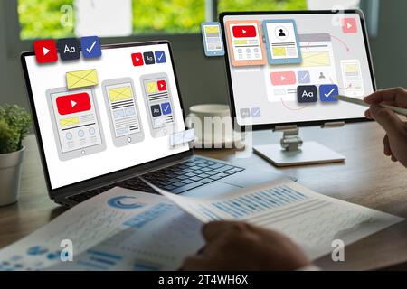 Team designers work on UI and UX designs for mobile app technology, digital interfaces, mobile screens, and mobile phone application design. Stock Photo