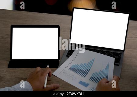 Businessman using a desktop compute mock up Using laptop with blank screen computer modern Stock Photo