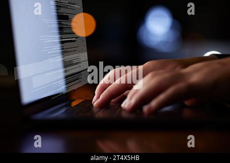 Laptop, coding and hands typing at night with information technology, programming and cybersecurity overlay. Person on computer closeup for software Stock Photo