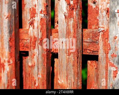 an old wooden fence that has been red Stock Photo