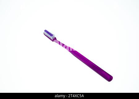 Purple toothbrush on white background Stock Photo