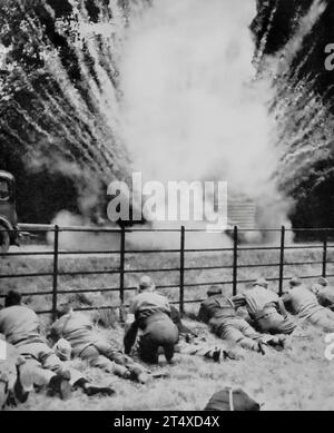 Local Defence Volunteers later to become the (British) Home Guard aka Dad's Army, see the effect of a Molotov Cocktail on a dummy tank towed by a car during training in July 1940. Stock Photo