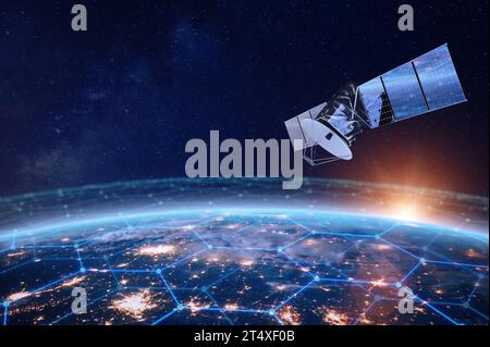 Telecommunication satellite providing global internet network and high speed data communication above Europe. Satellite in space, low Earth orbit. Wor Stock Photo