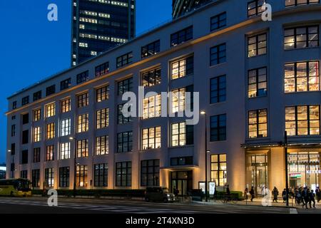 Tokyo, Japan-March 31, 2023; Evening view façade of KITTE retail facility (former Tokyo Central Post Office) in high rise office building JP TOWER in Stock Photo