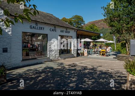 People tourists visitors at the cafe outside Heaton Cooper Studio  in summer Grasmere village Cumbria England UK United Kingdom GB Great Britain Stock Photo