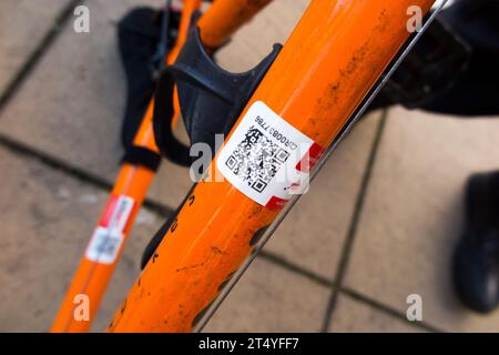 Police community support officer security marking a bicycle frame with permanent reference number at a popular Twickenham car park. London. UK. (136) Stock Photo