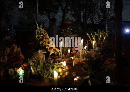 Non Exclusive: November 1, 2023, Mexico City, Mexico: Families decorate the graves of their loved ones, children and also vigil the graves of adults a Stock Photo