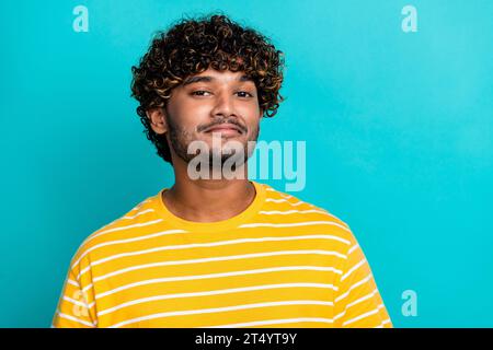 Photo portrait of attractive young man look camera proudly wear trendy striped yellow clothes isolated on aquamarine color background Stock Photo