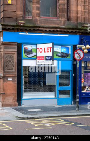 To Let sign on the shop front of a permanently closed business, Bath Street, Glasgow, Scotland, UK, Europe Stock Photo