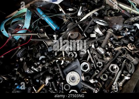 A pile of old spare parts in a garage. Stock Photo
