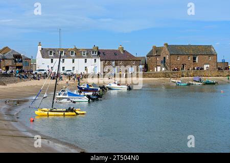 The beach in Stonehaven harbour, Aberdeenshire, Scotland, UK.  To the right is the 16th century Tolbooth building, now a museum and restaurant. Stock Photo