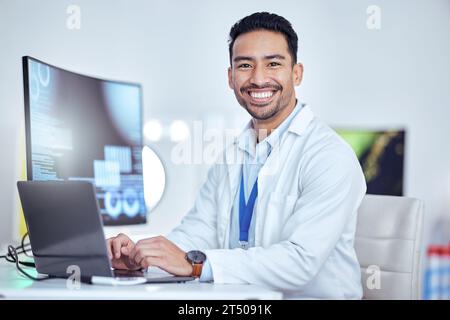 Scientist, portrait and man on laptop in laboratory for medical research, innovation and data analysis. Happy asian male researcher working on Stock Photo