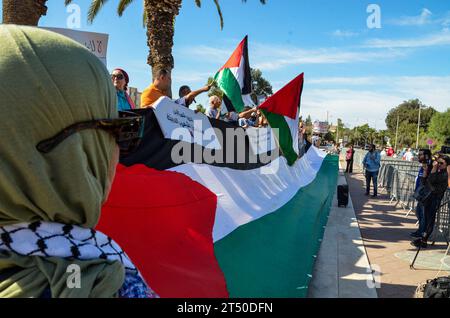 November 2, 2023: Tunis, Tunisia. 02 November 2023. Protesters waive the Palestinian flag and chant slogans in support of Palestinians and against the Israeli military offensive in Gaza outside the Parliament building in Tunis. The demonstration coincided with an extraordinary session by the Tunisian parliament discussing a draft law criminalising the normalisation of relations with Israel. If approved, the draft law would criminalise economic, cultural, and military ties with Israel (Credit Image: © Hasan Mrad/IMAGESLIVE via ZUMA Press Wire) EDITORIAL USAGE ONLY! Not for Commercial USAGE! Stock Photo